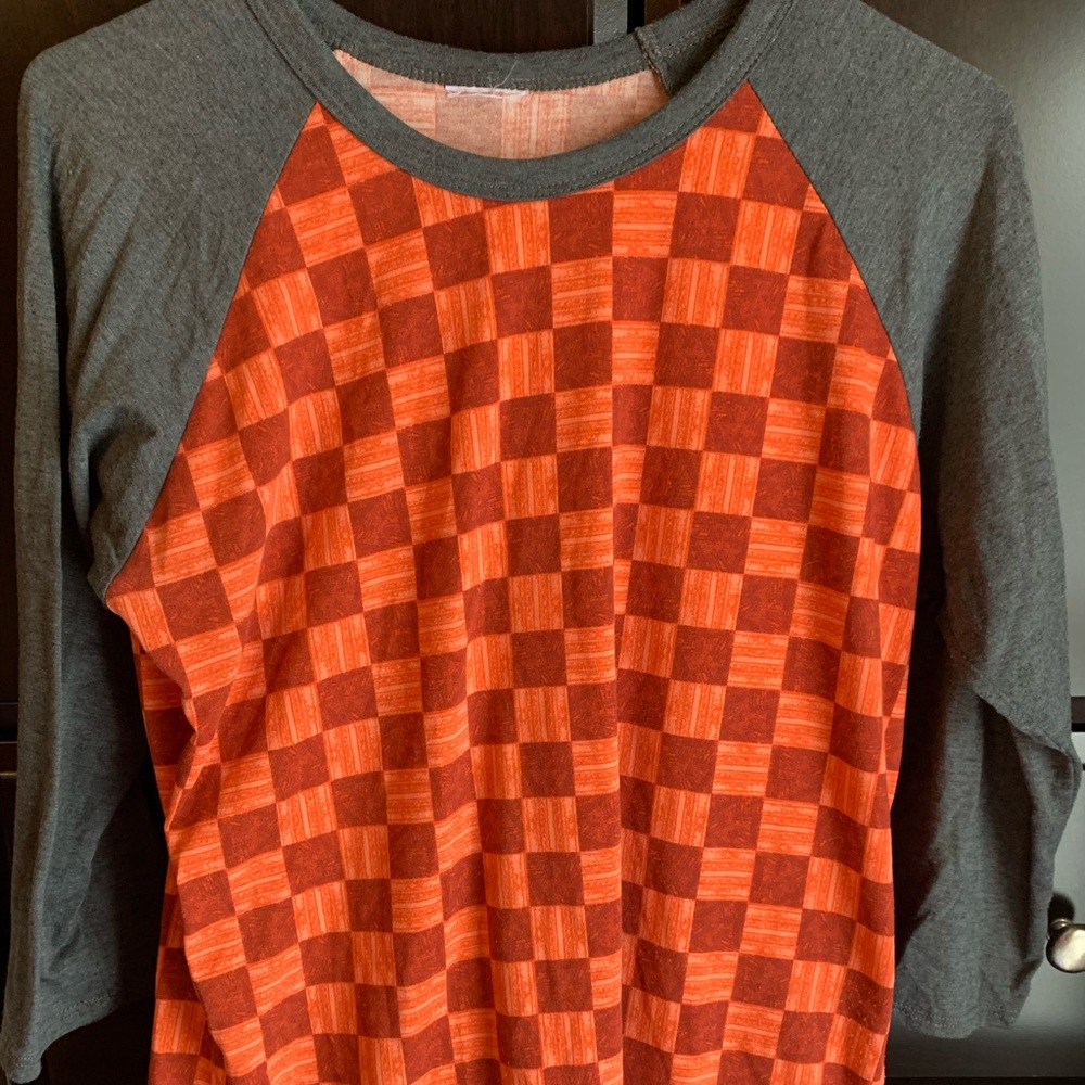 Lularoe Randy tee, 3/4 sleeve, orange, red print with grey sleeves. Size M